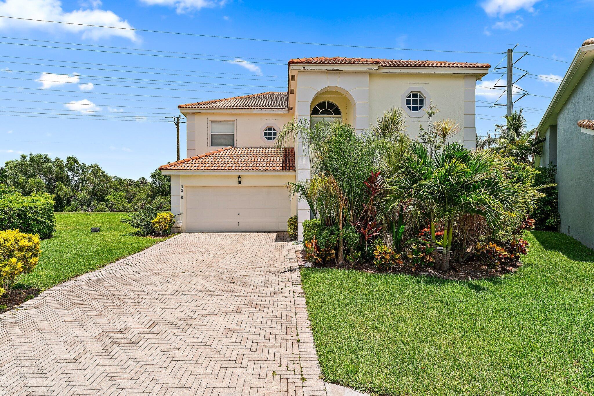 a view of front of house with a yard