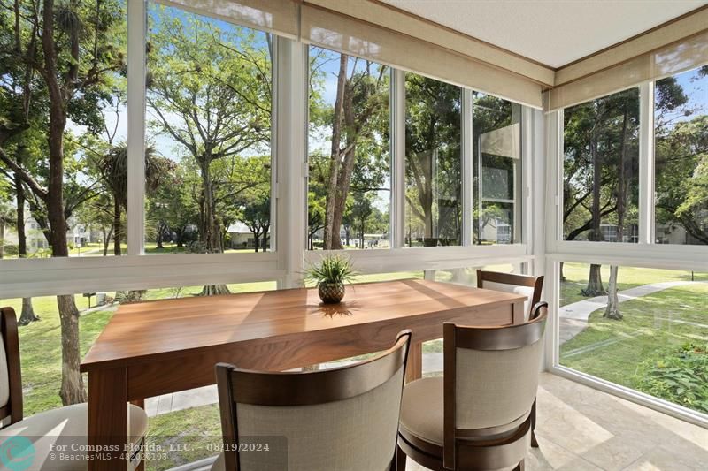 a outdoor dining space with furniture and garden view