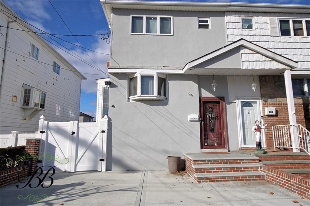 a front view of a house with a garage