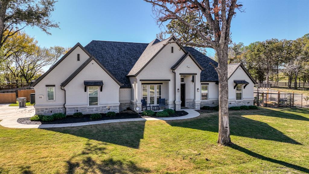 View of front of house with a front yard