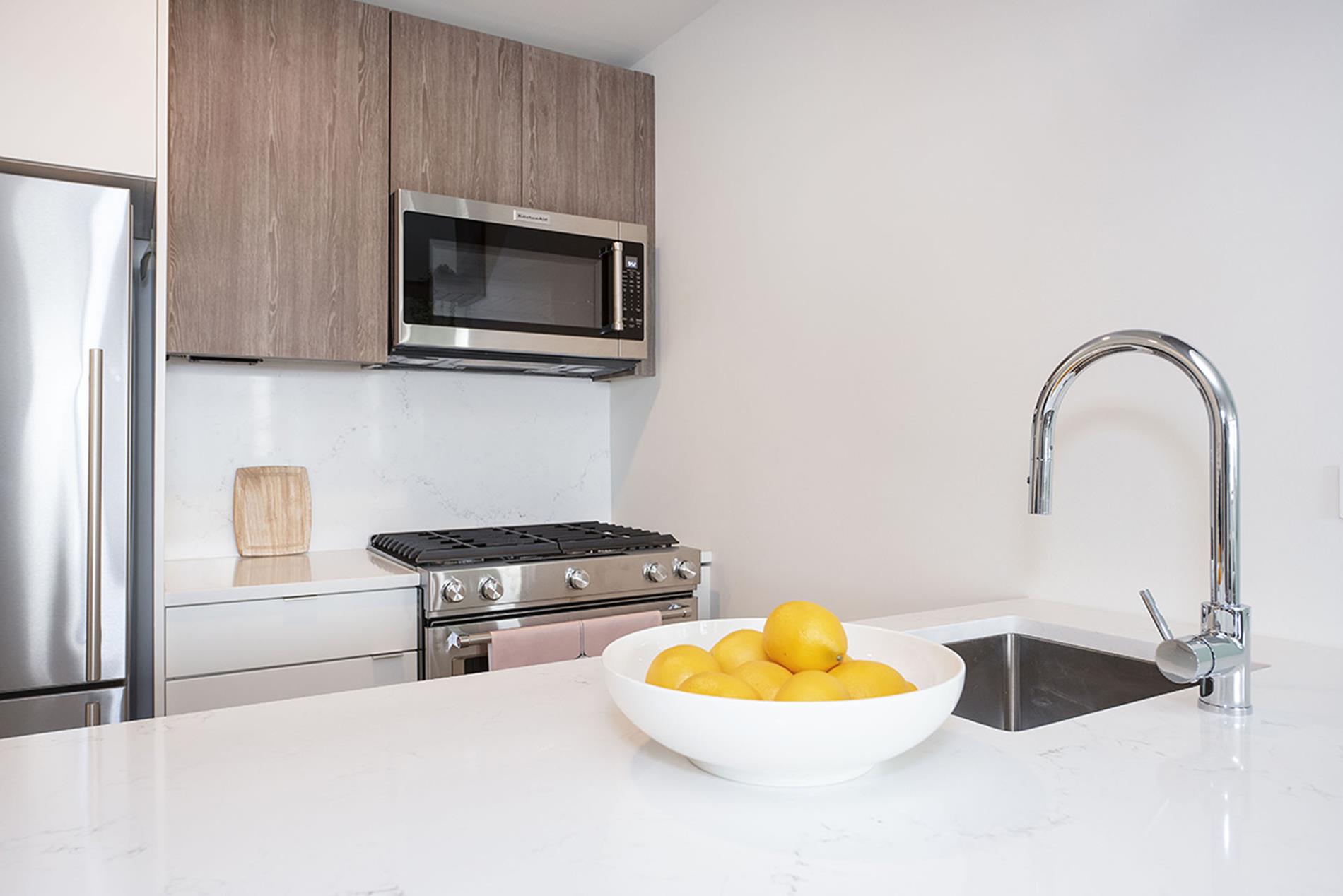 a kitchen with a stove and a microwave