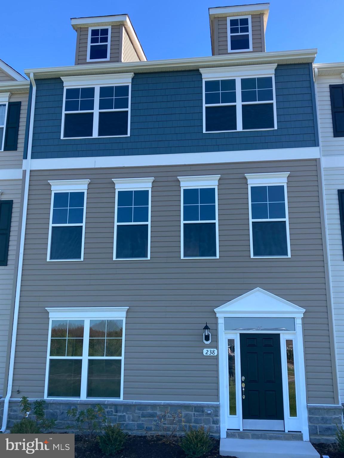 a front view of a building with windows