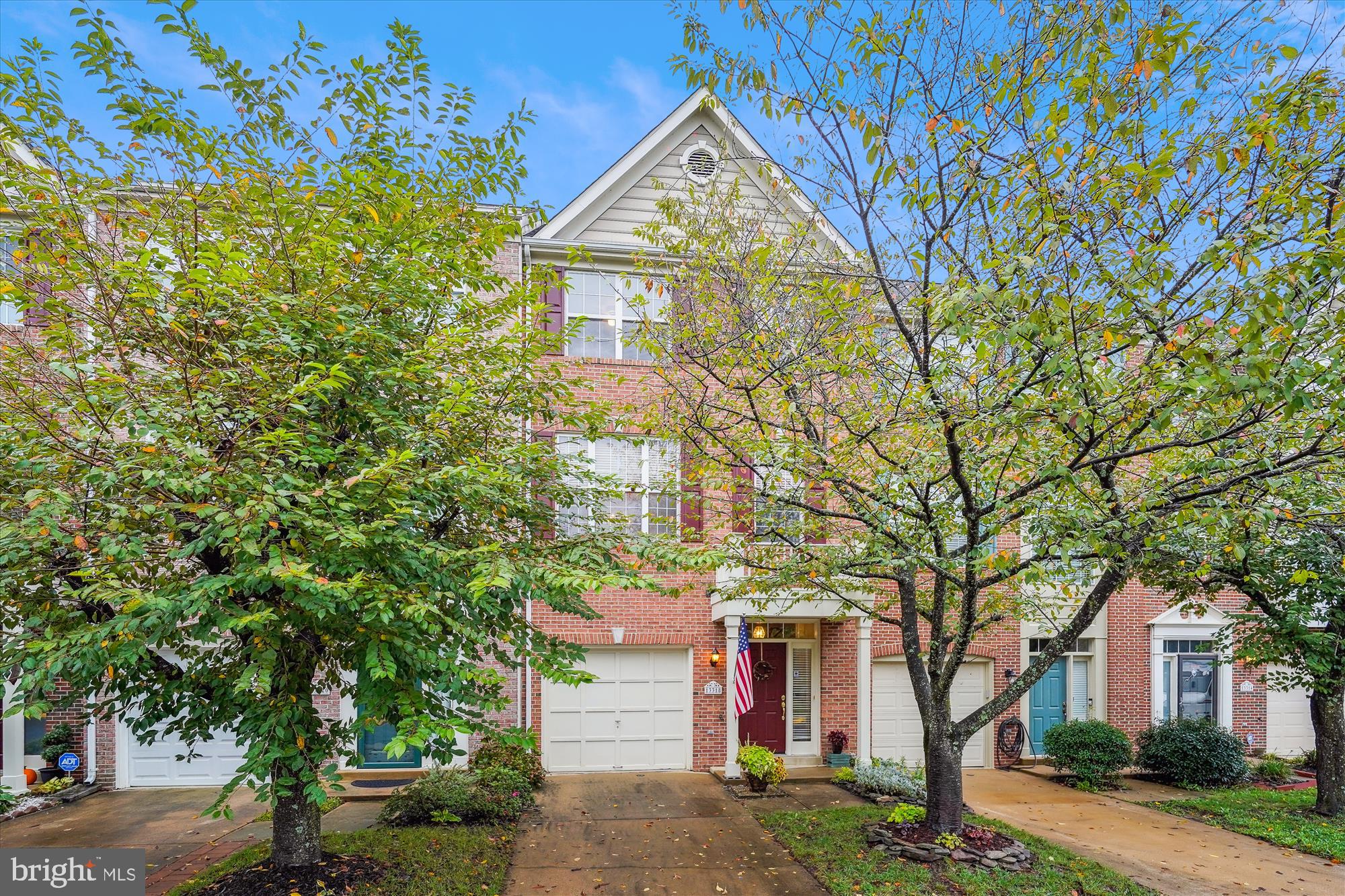 front view of a house with a tree