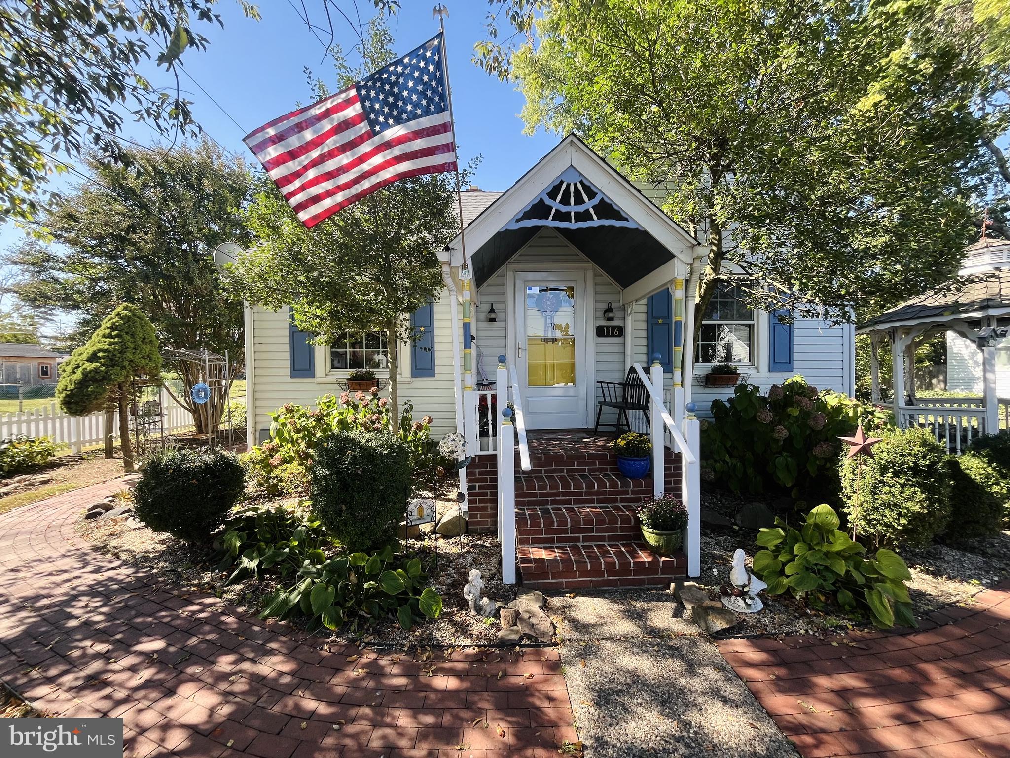 a front view of a house with yard