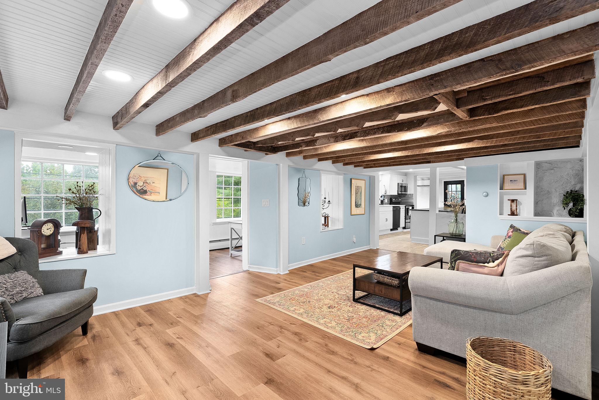 Family room with org. exposed beams