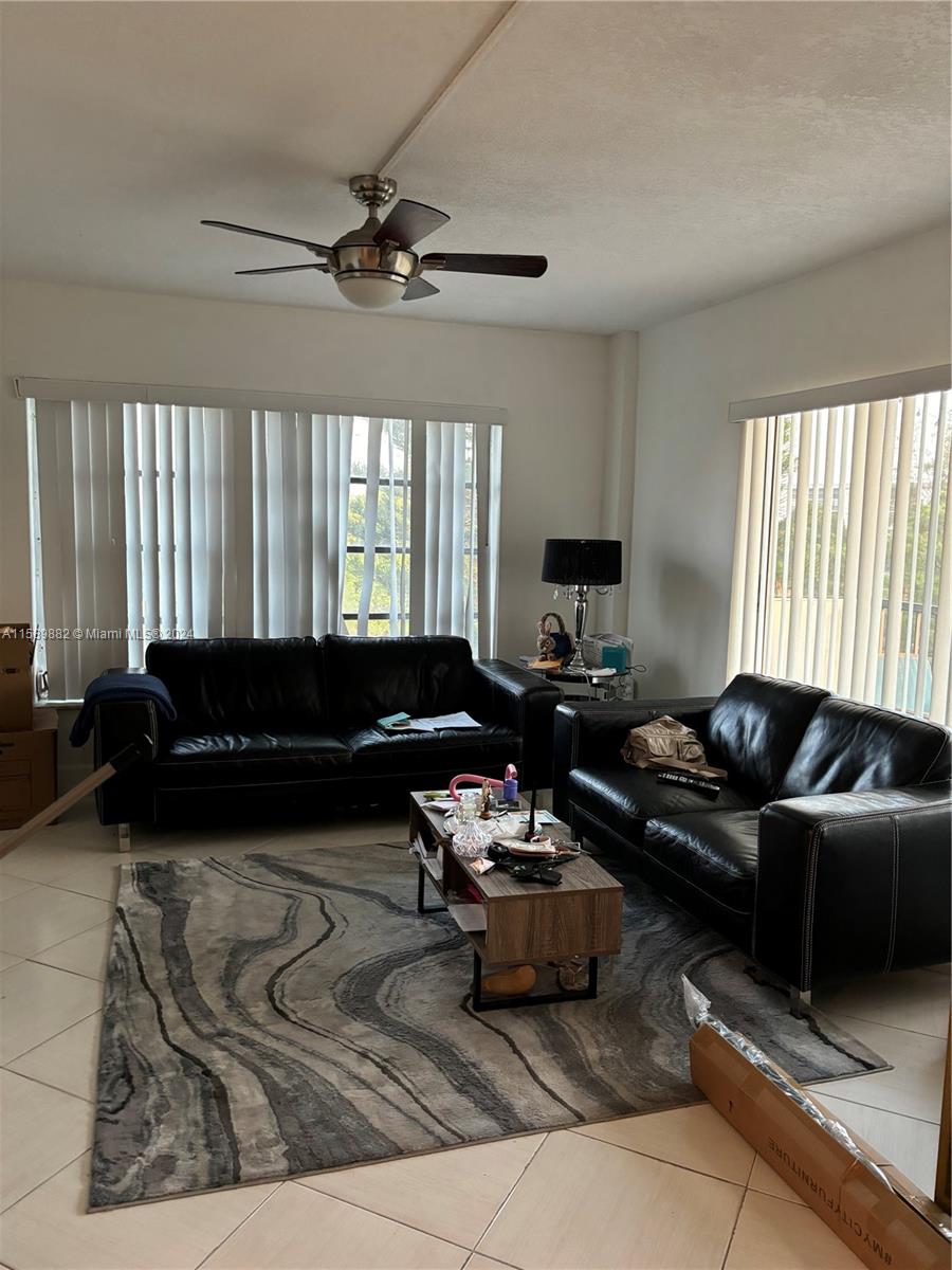 a living room with furniture and window