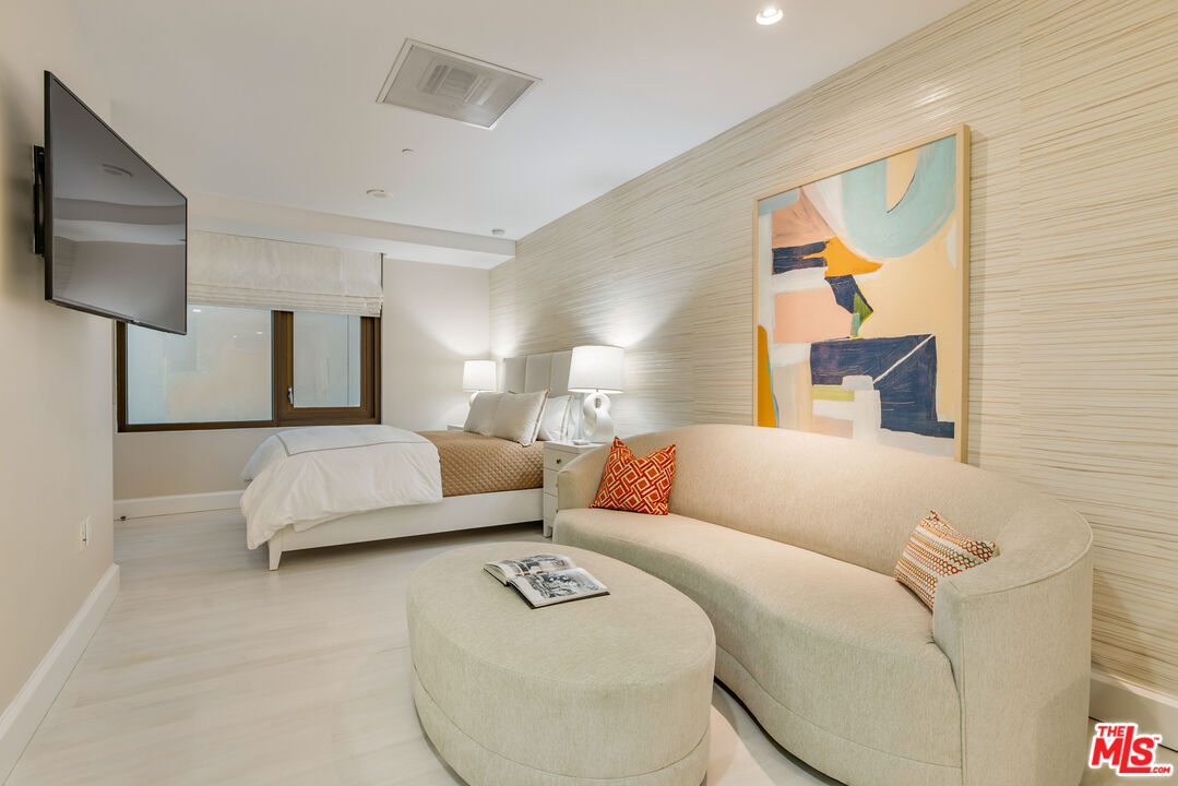 a living room with a couch and a flat screen tv