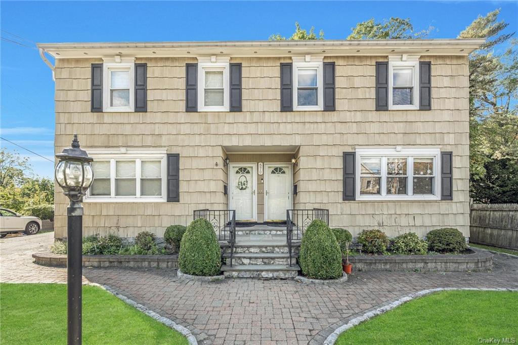 View of front of house with a front lawn