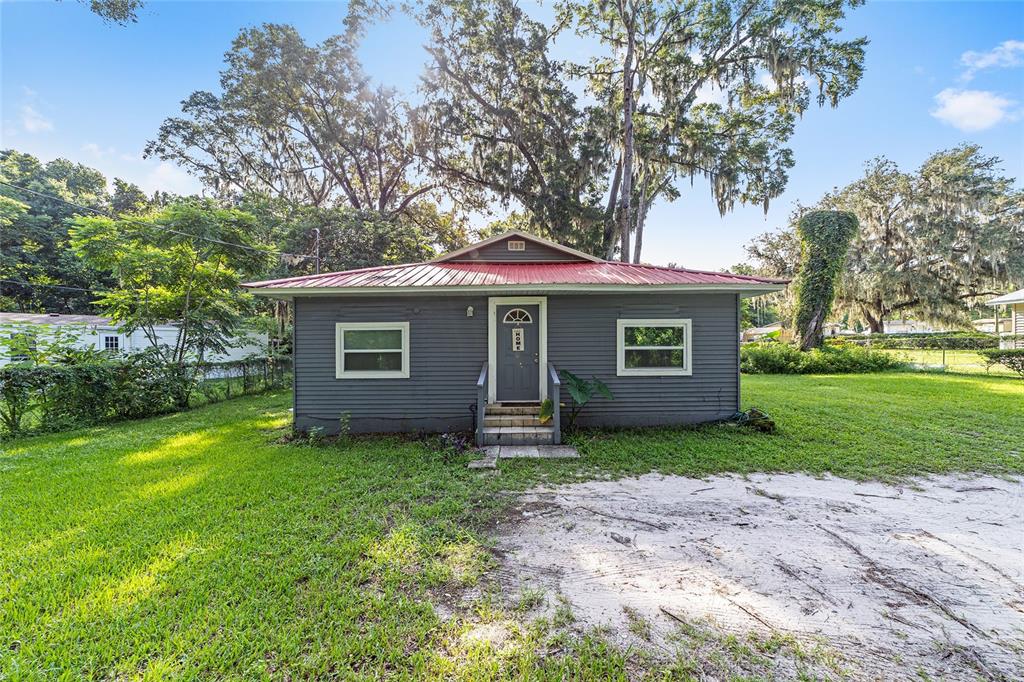 front view of a house with a yard