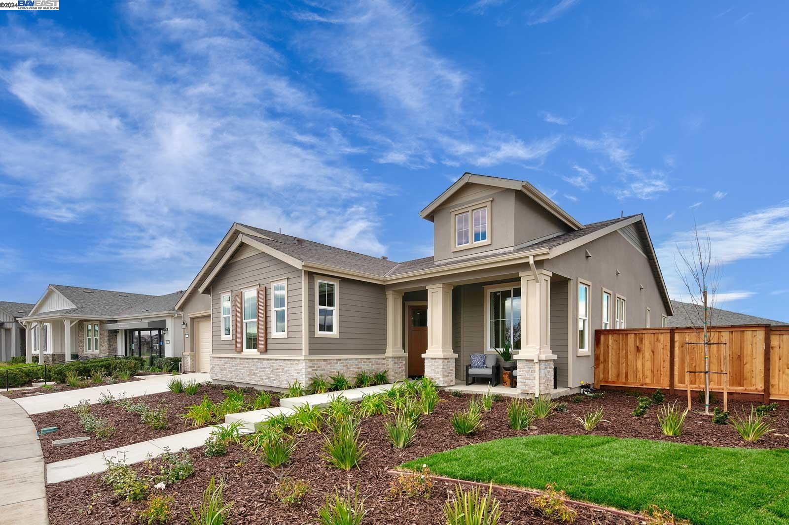 a front view of a house with a yard and porch