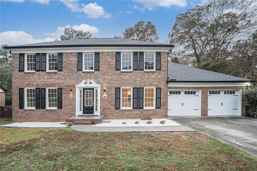 a front view of a house with a yard