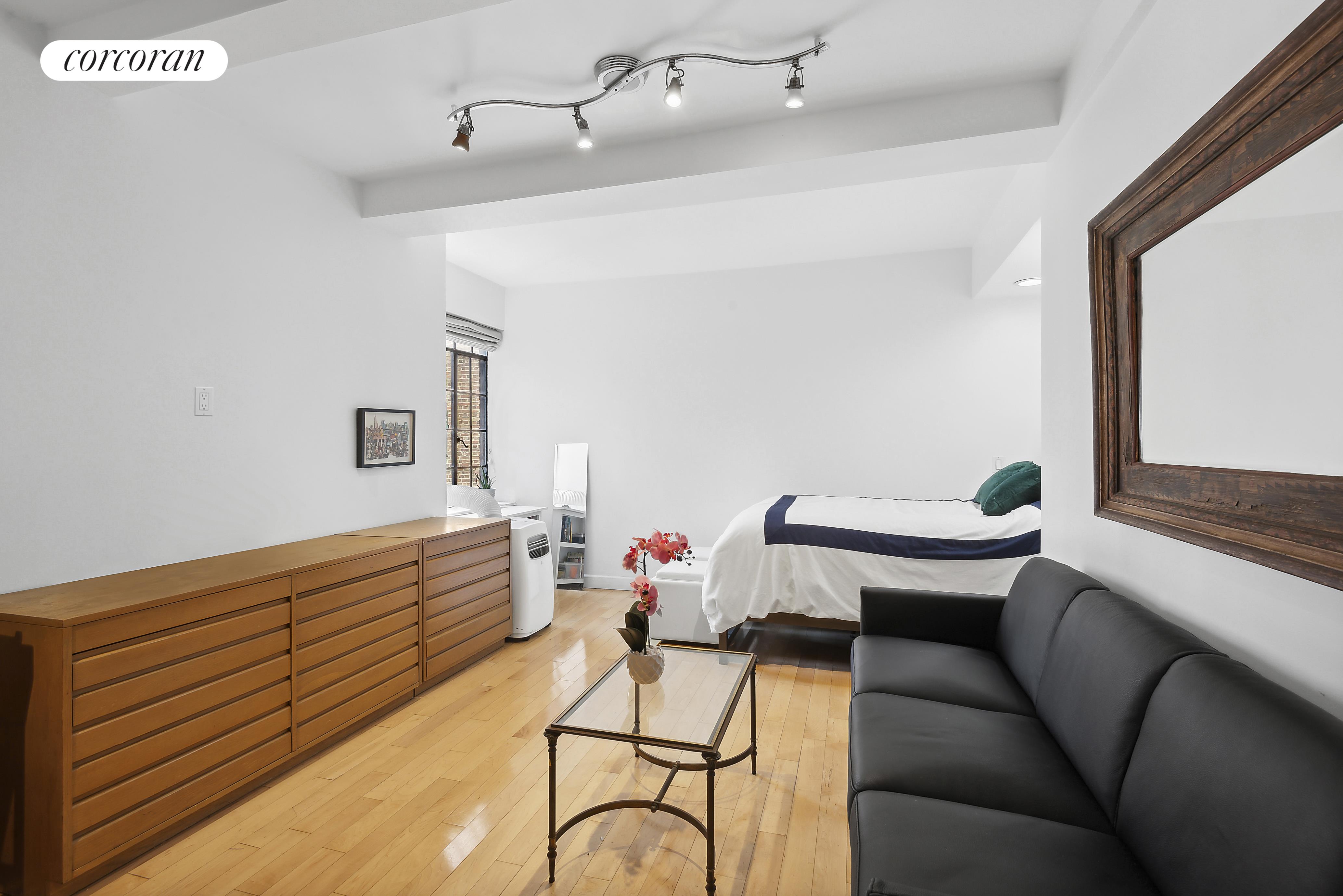 a living room with furniture and white walls