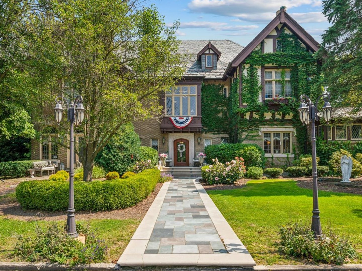 a front view of a house with garden