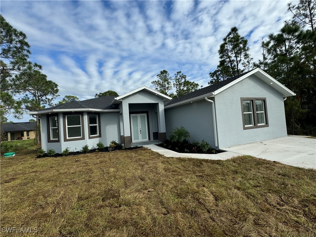 a front view of a house with a yard