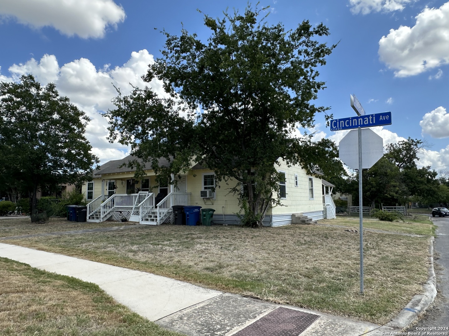 a view of a house with a tree