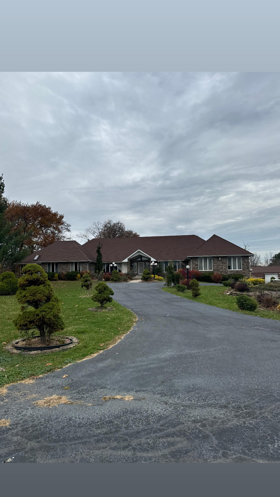 a view of a road with a big yard