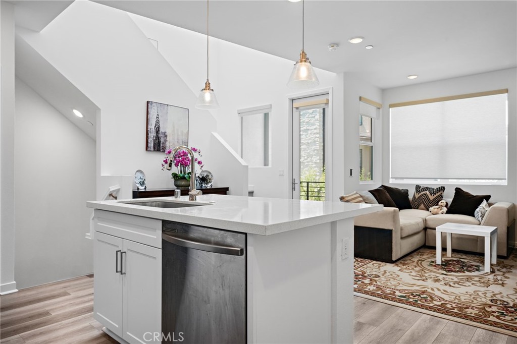 a kitchen with a sink cabinets and window