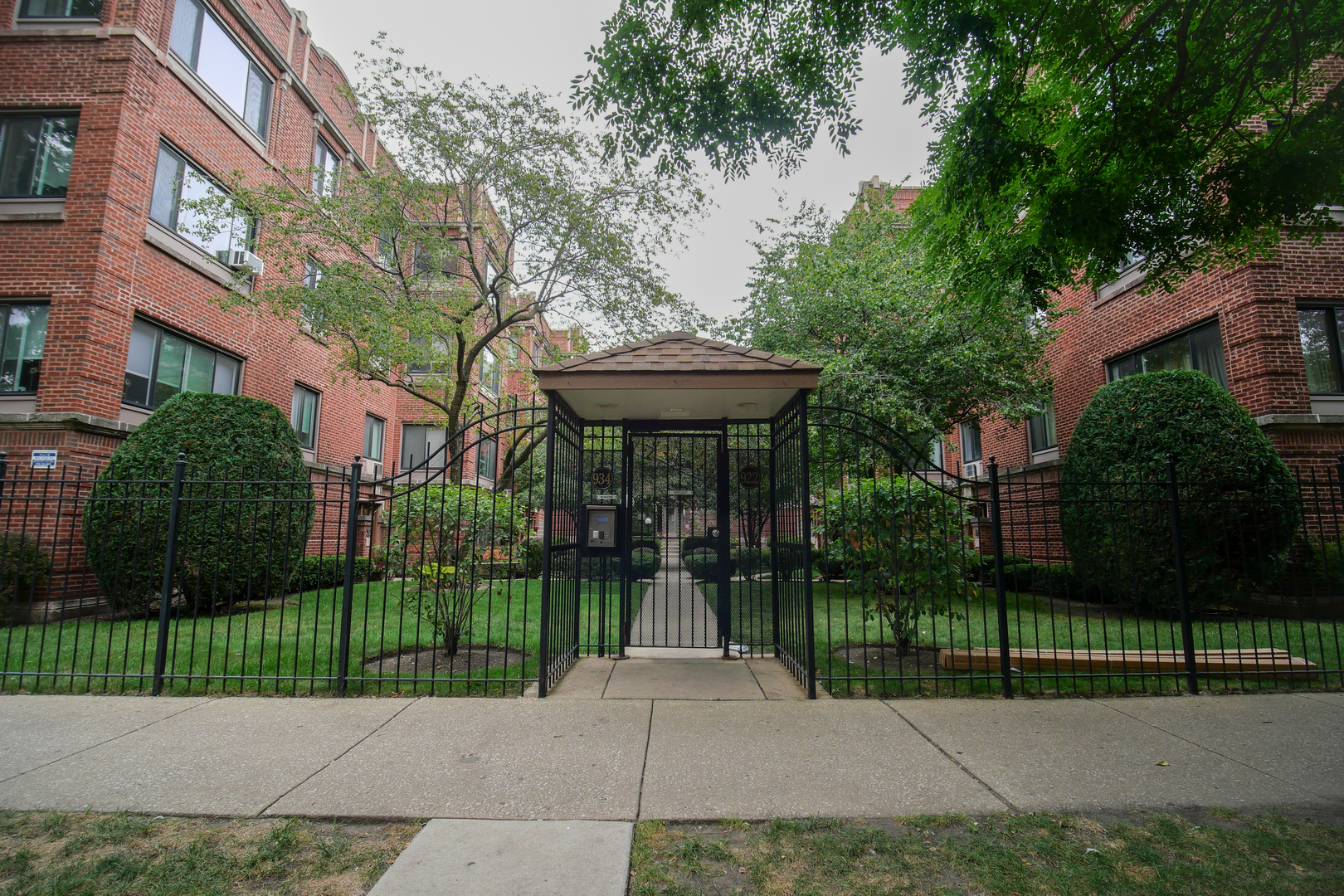 a view of a garden with a staircase in front of the house