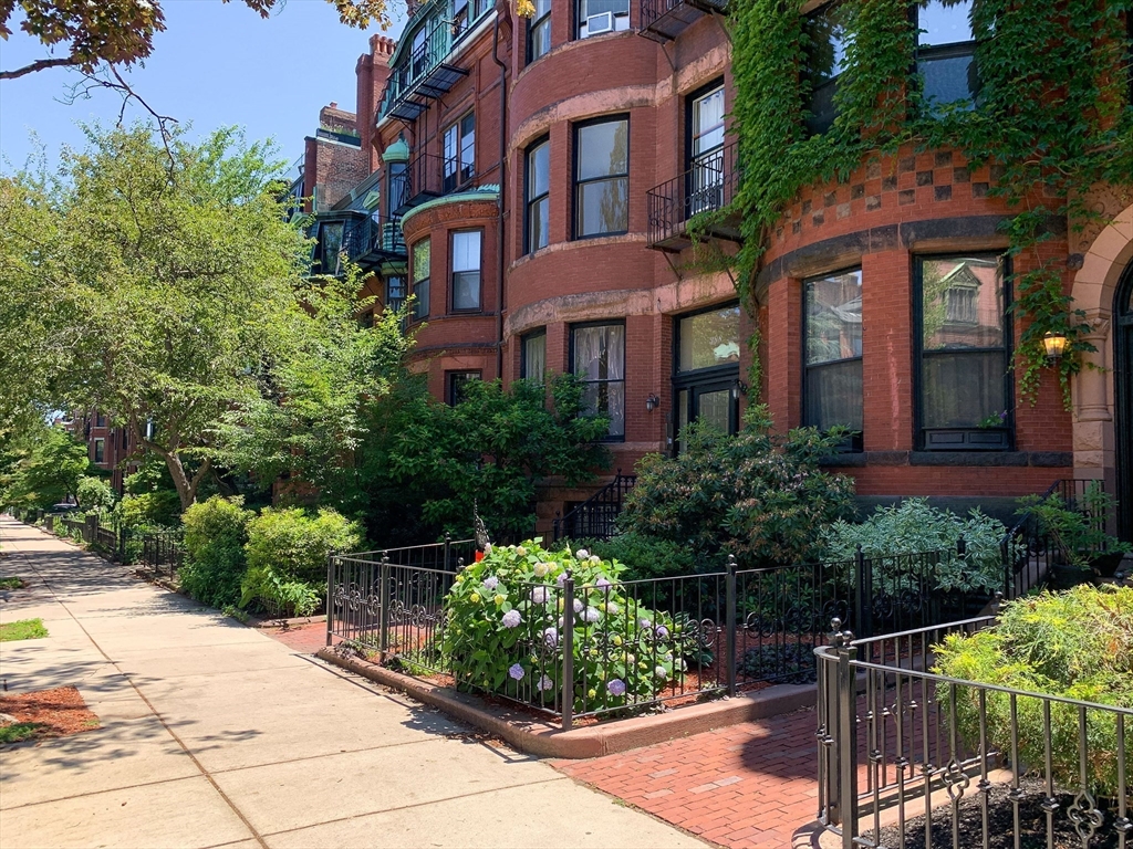 a view of a building with potted plants