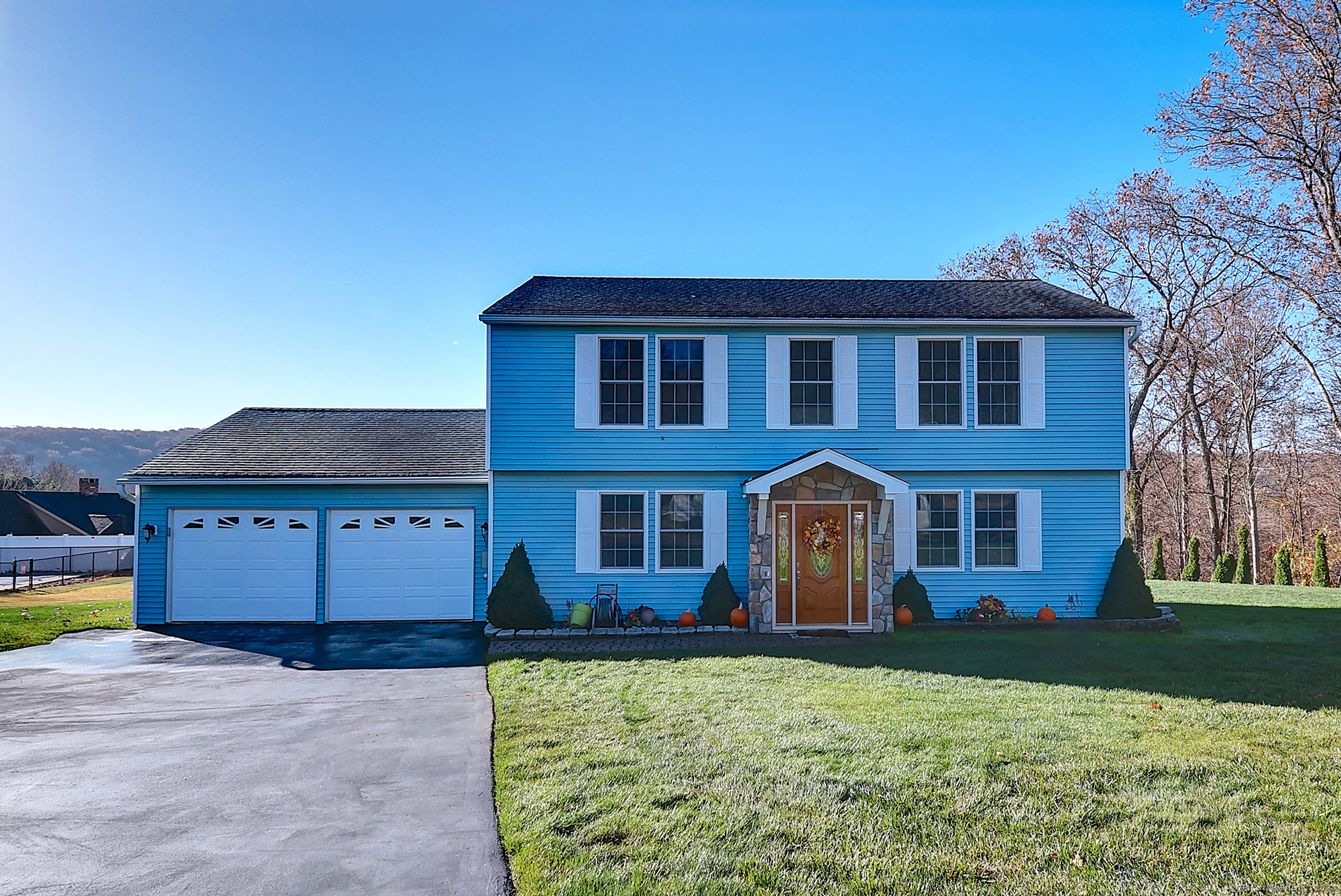 a front view of a house with a yard