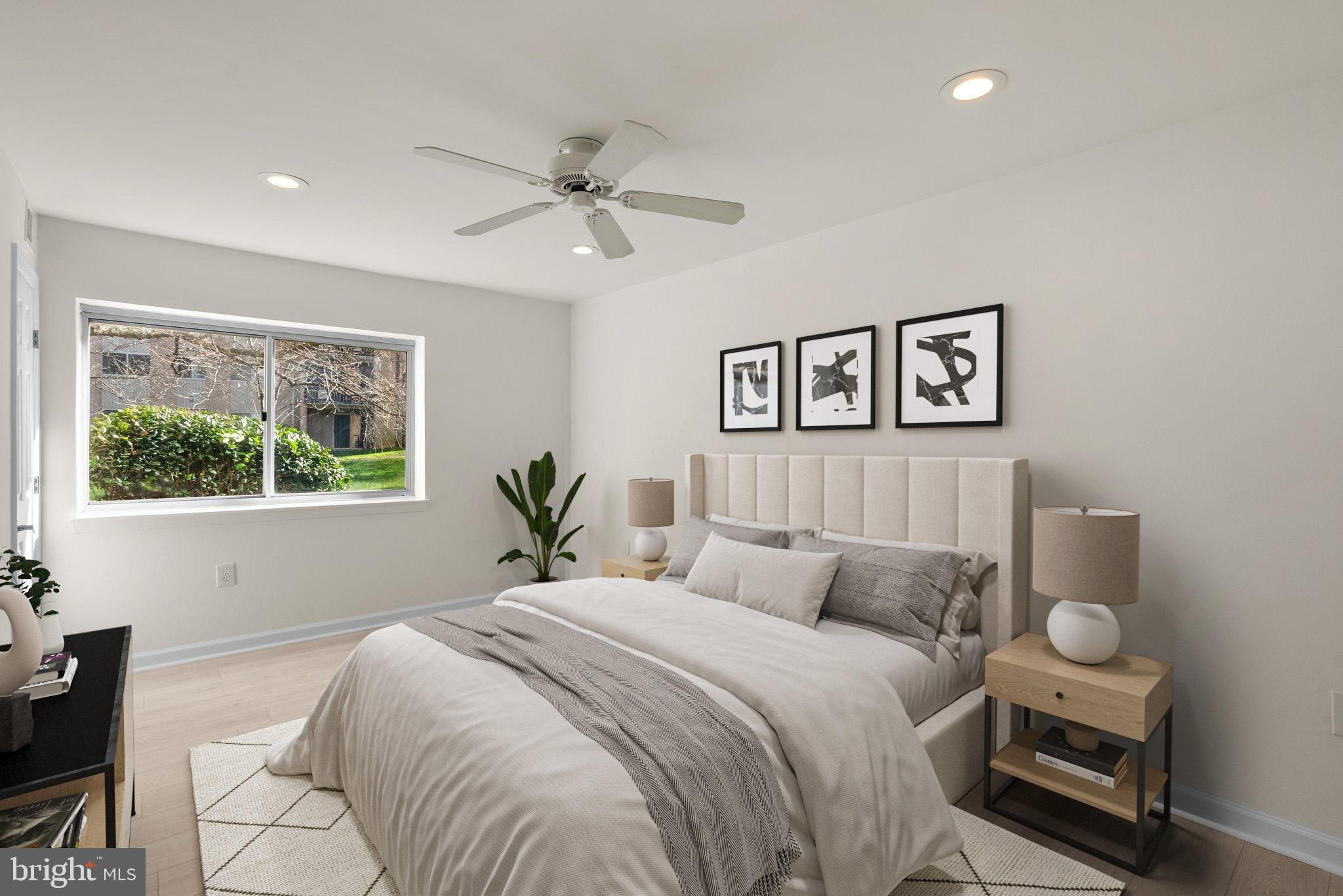 a bedroom with a large bed and a window