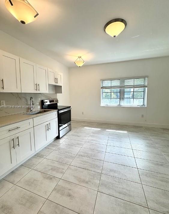 a kitchen with a cabinets and appliances