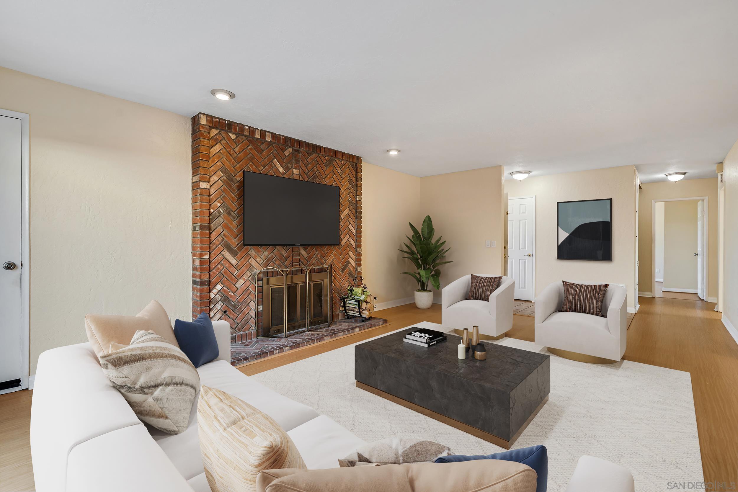 a living room with furniture and a flat screen tv