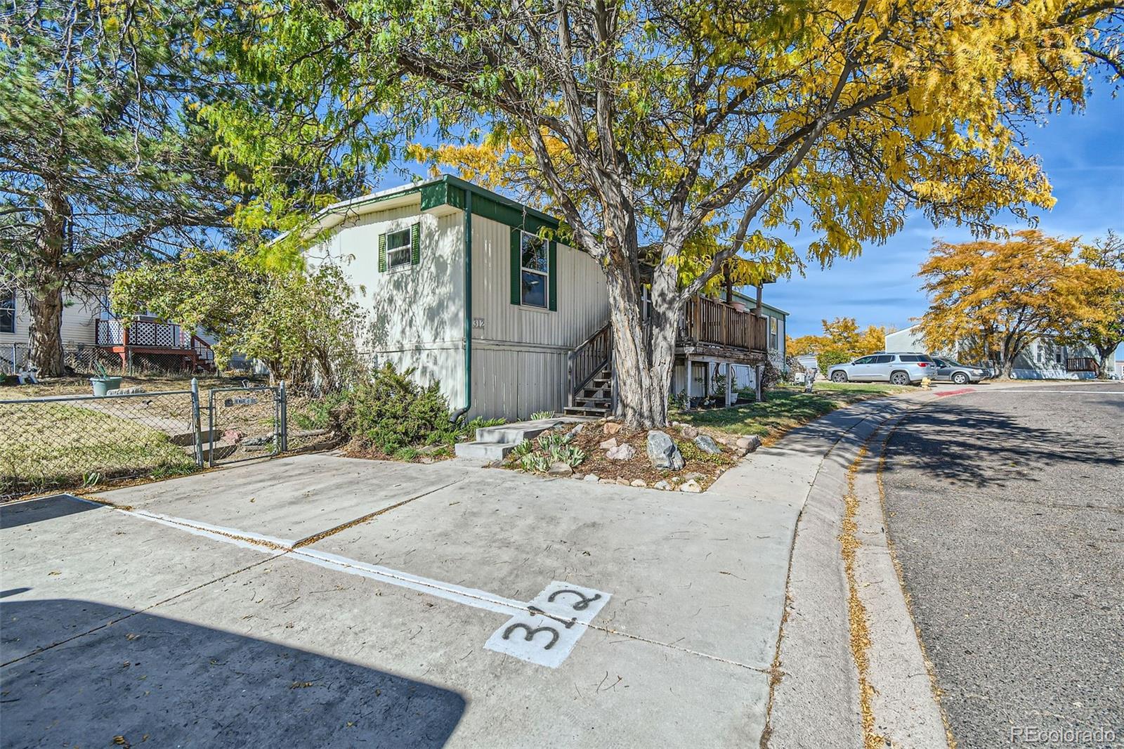 a view of a house with snow on the road