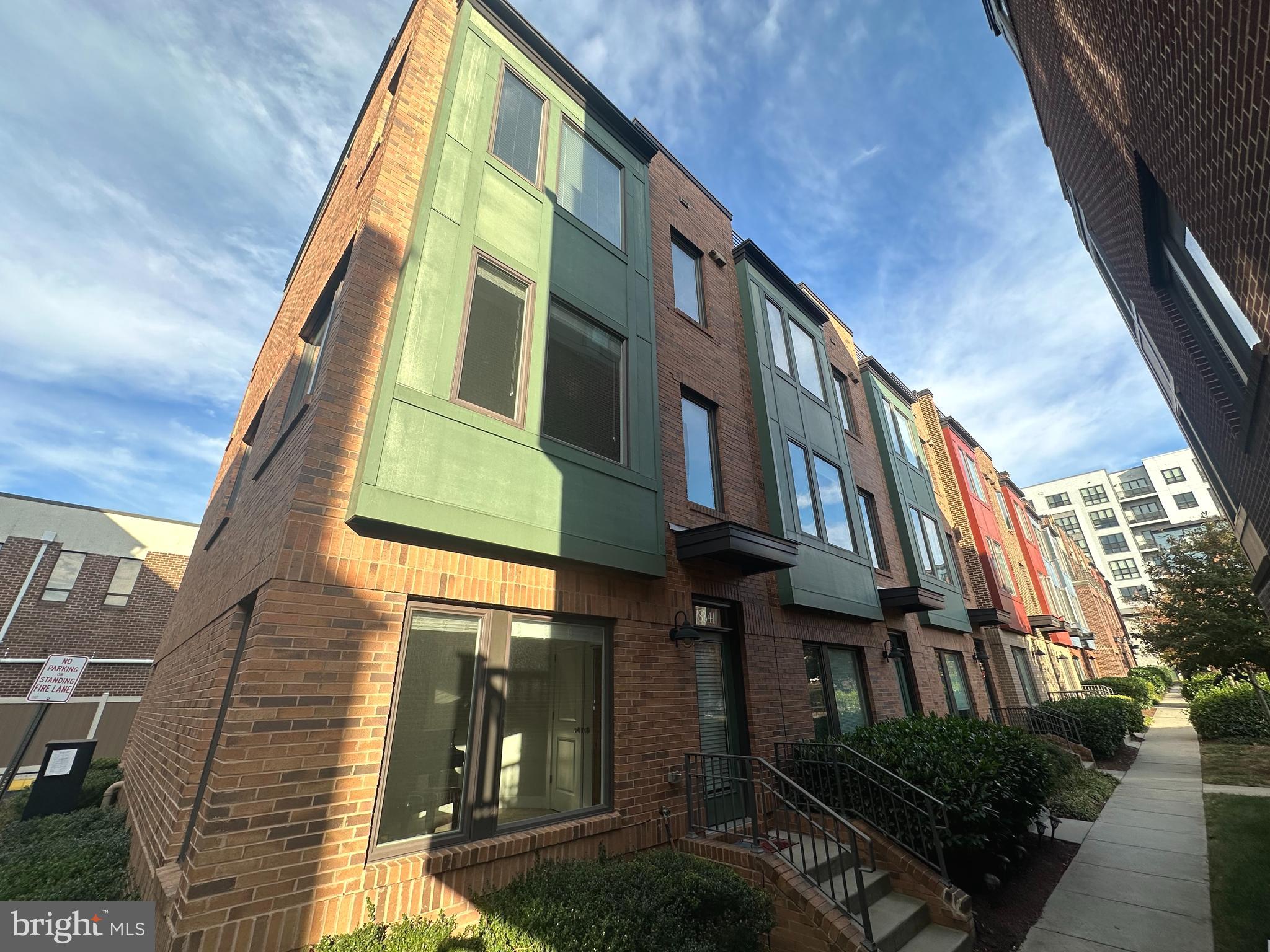 a view of a brick building with many windows