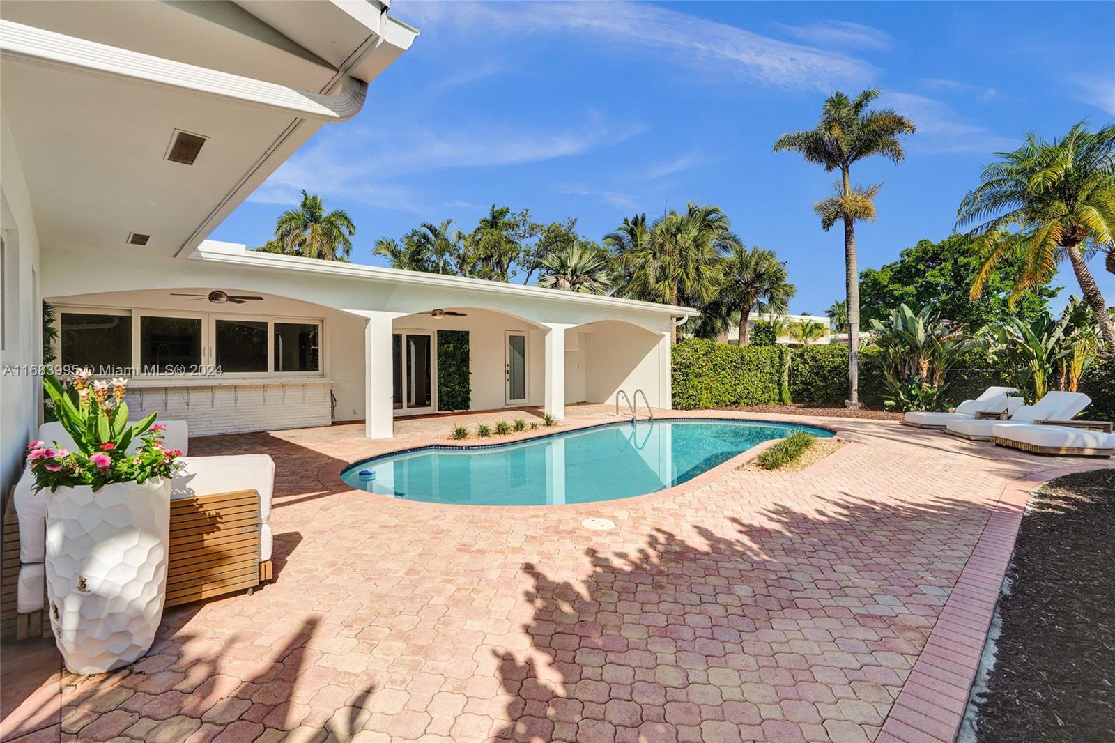 a view of a house with swimming pool