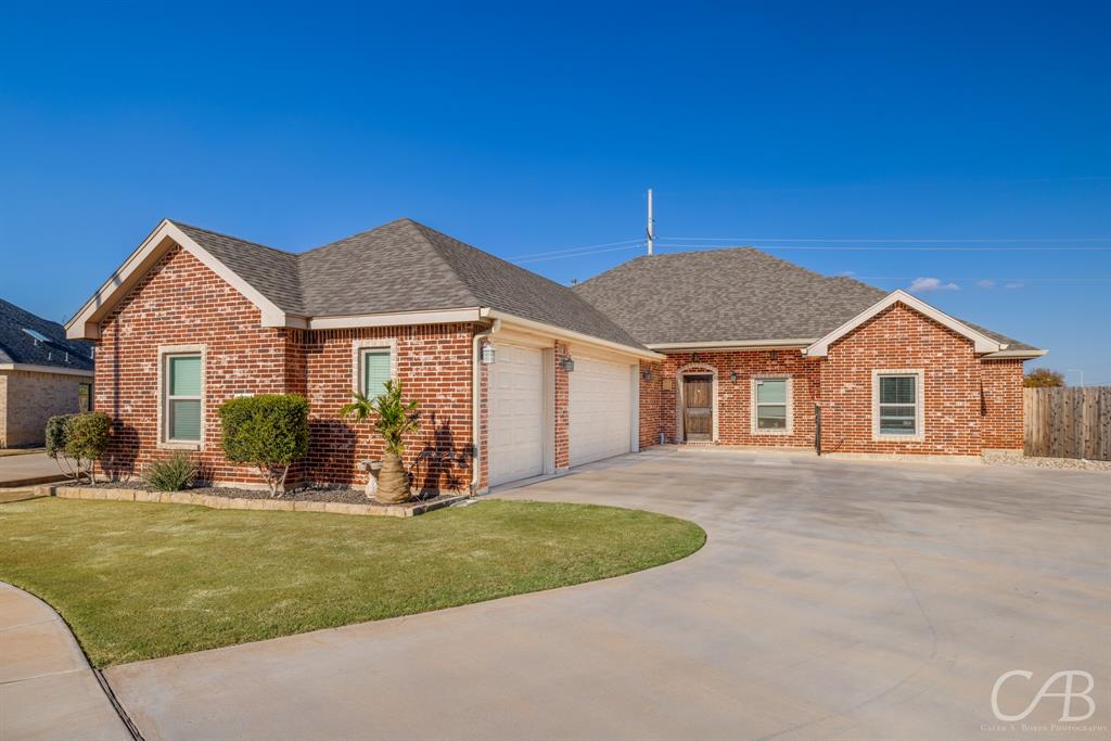 a front view of a house with yard