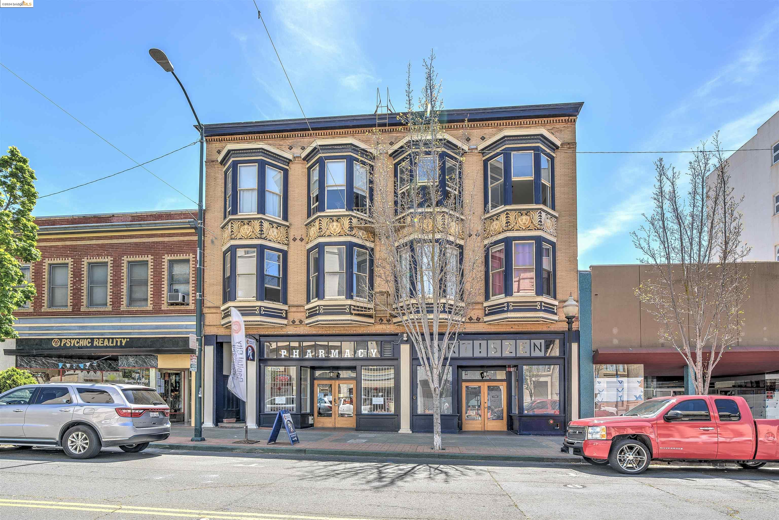 a front view of a building with parking space and parking space