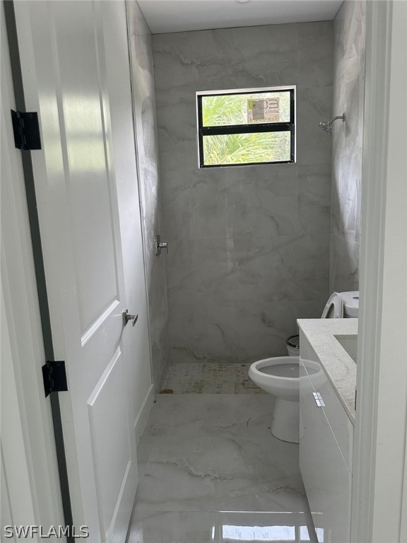 a bathroom with a toilet and a sink