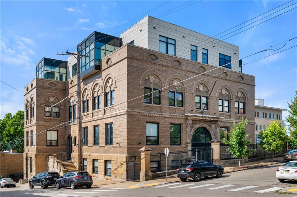 a front view of a building with street view