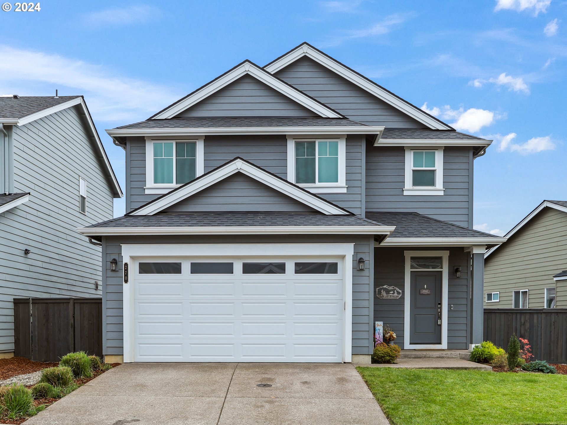 a front view of a house with a yard