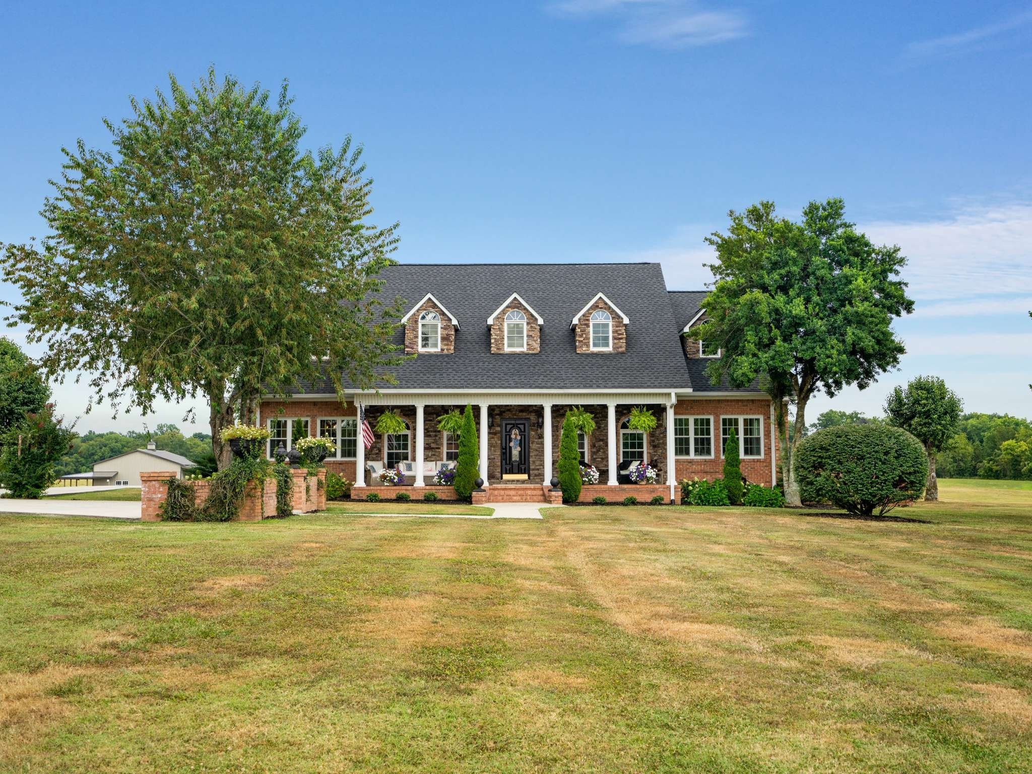 a front view of a house with a yard