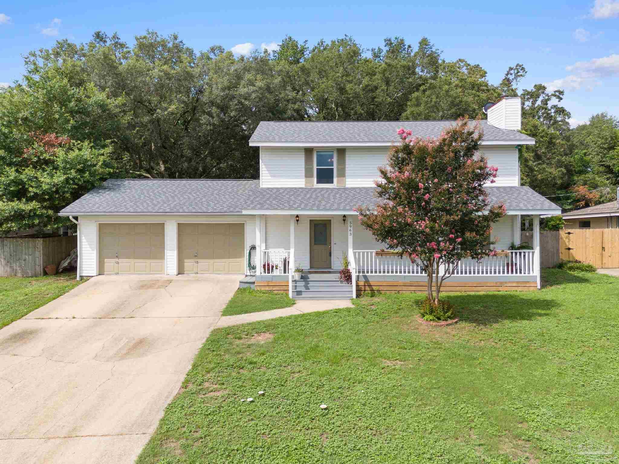 a view of a house with a yard porch and sitting area