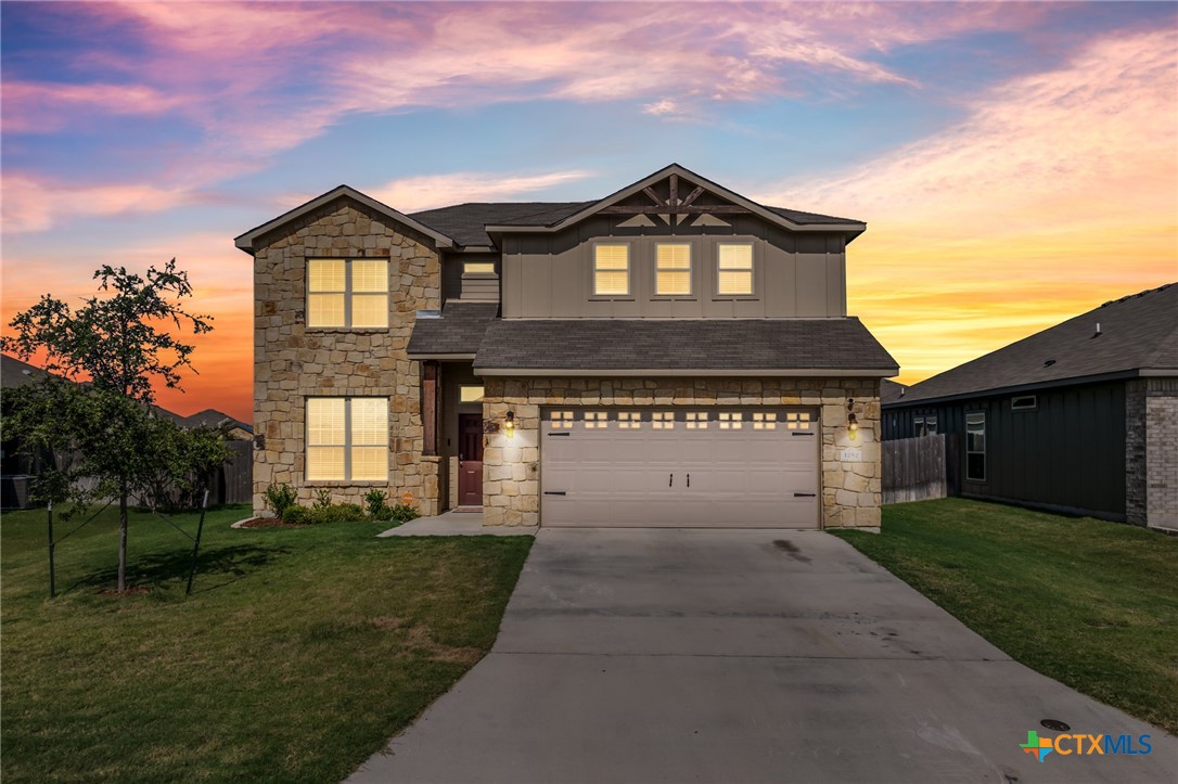 a front view of a house with a yard