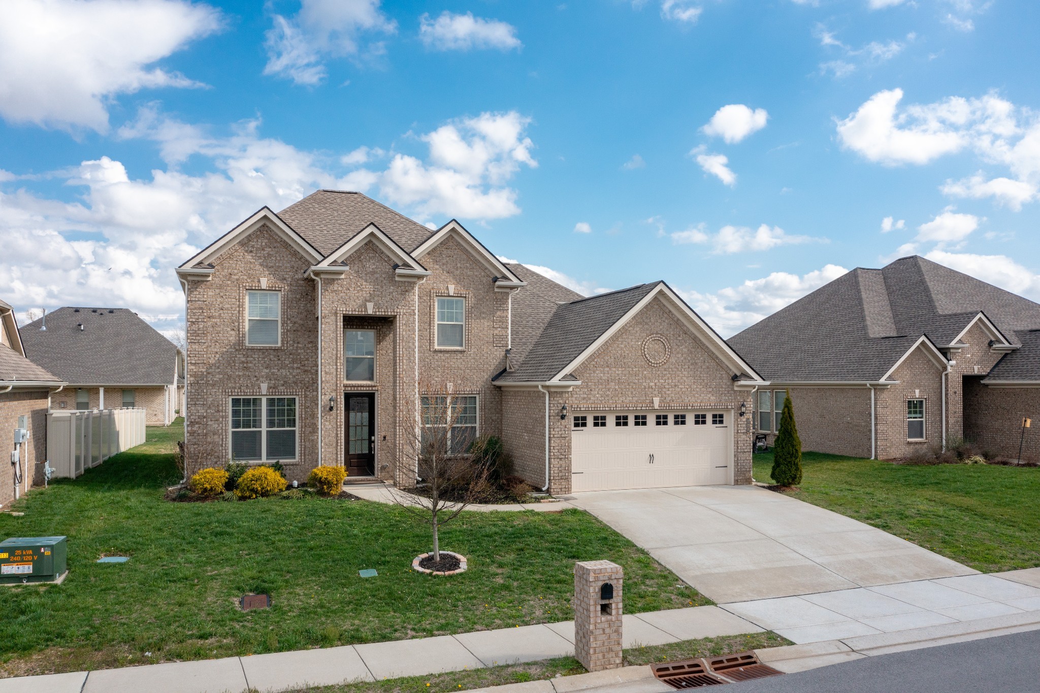 a front view of a house with a yard