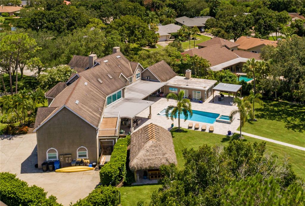 an aerial view of multiple houses with yard