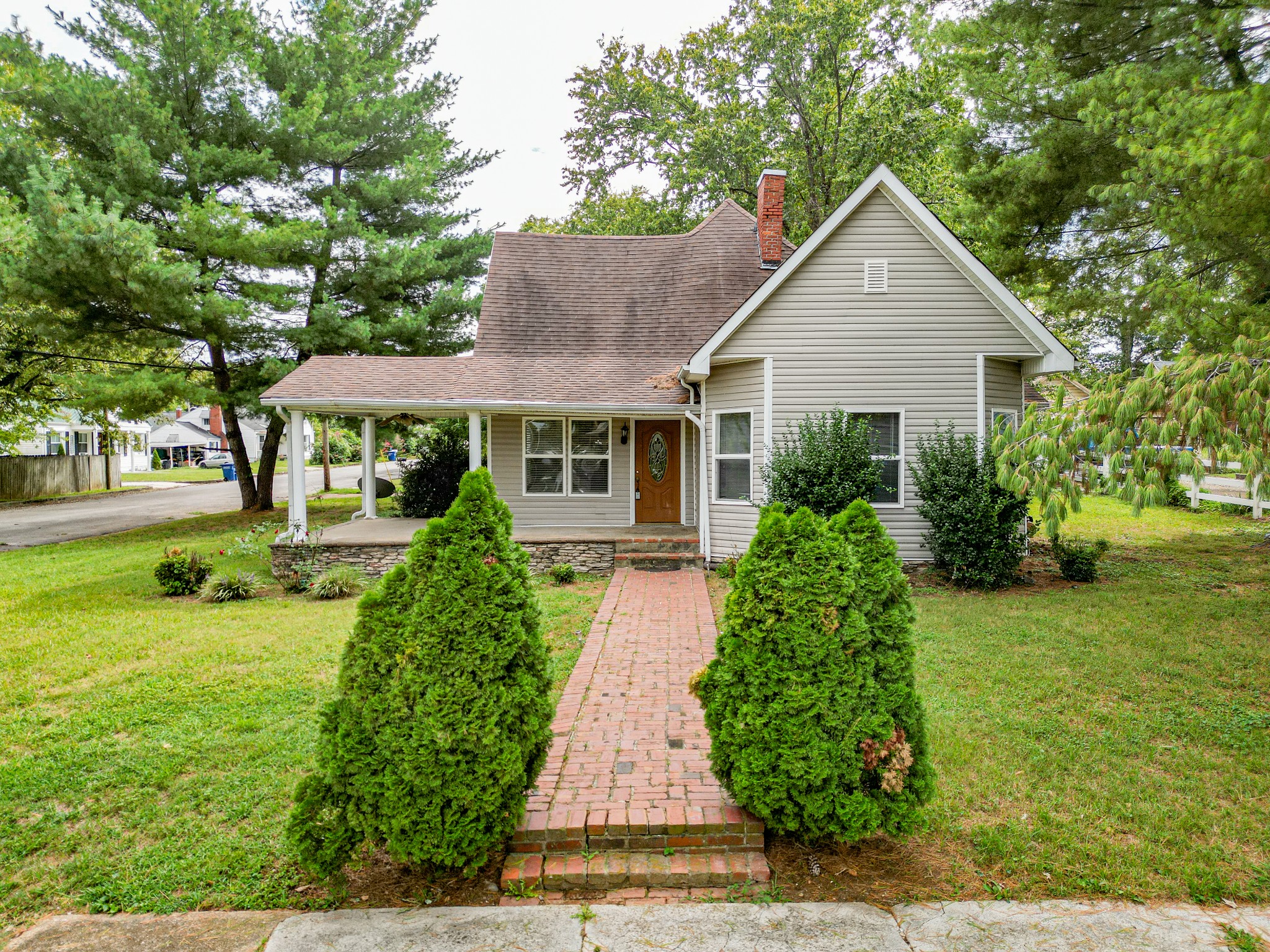 a front view of a house with garden