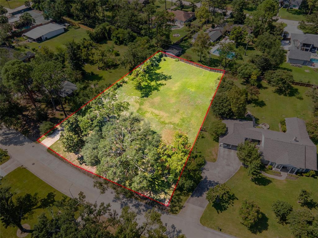 an aerial view of a residential houses with outdoor space