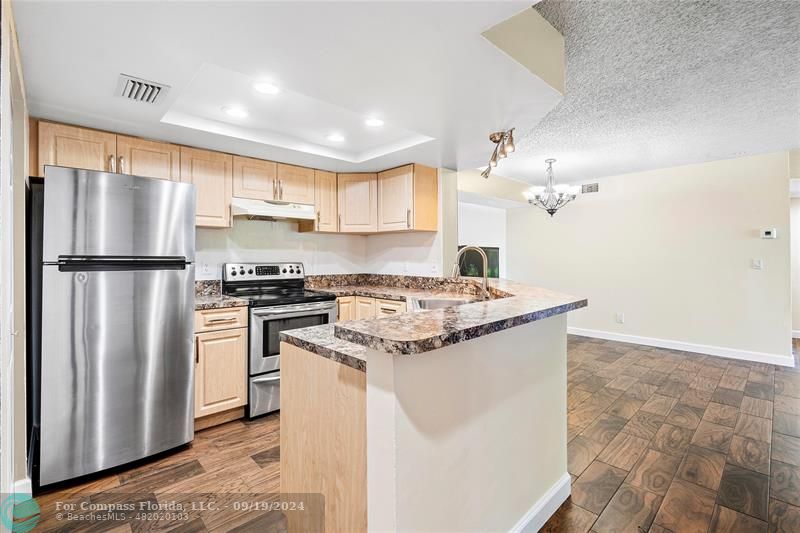 Open Kitchen with SS Appliances