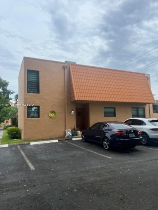 a front view of a house with parking