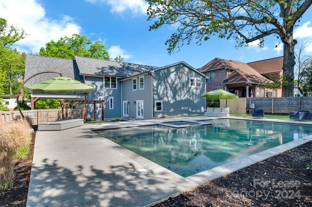 a view of a swimming pool with a patio