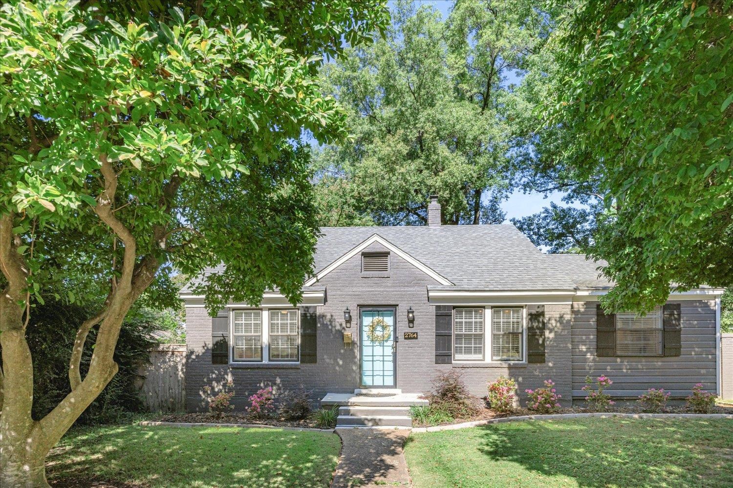 front view of a house with a yard