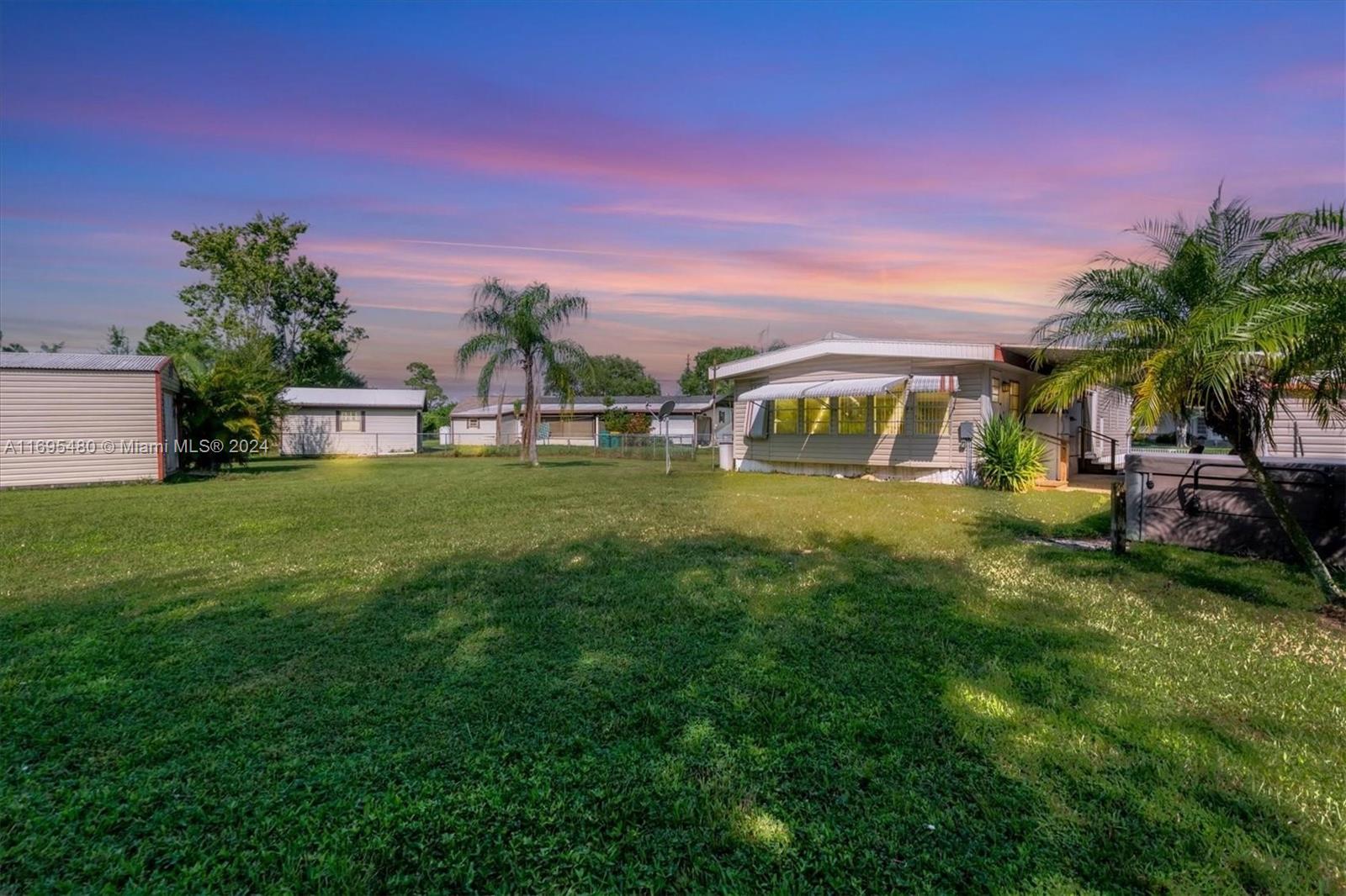 a view of a house with a big yard