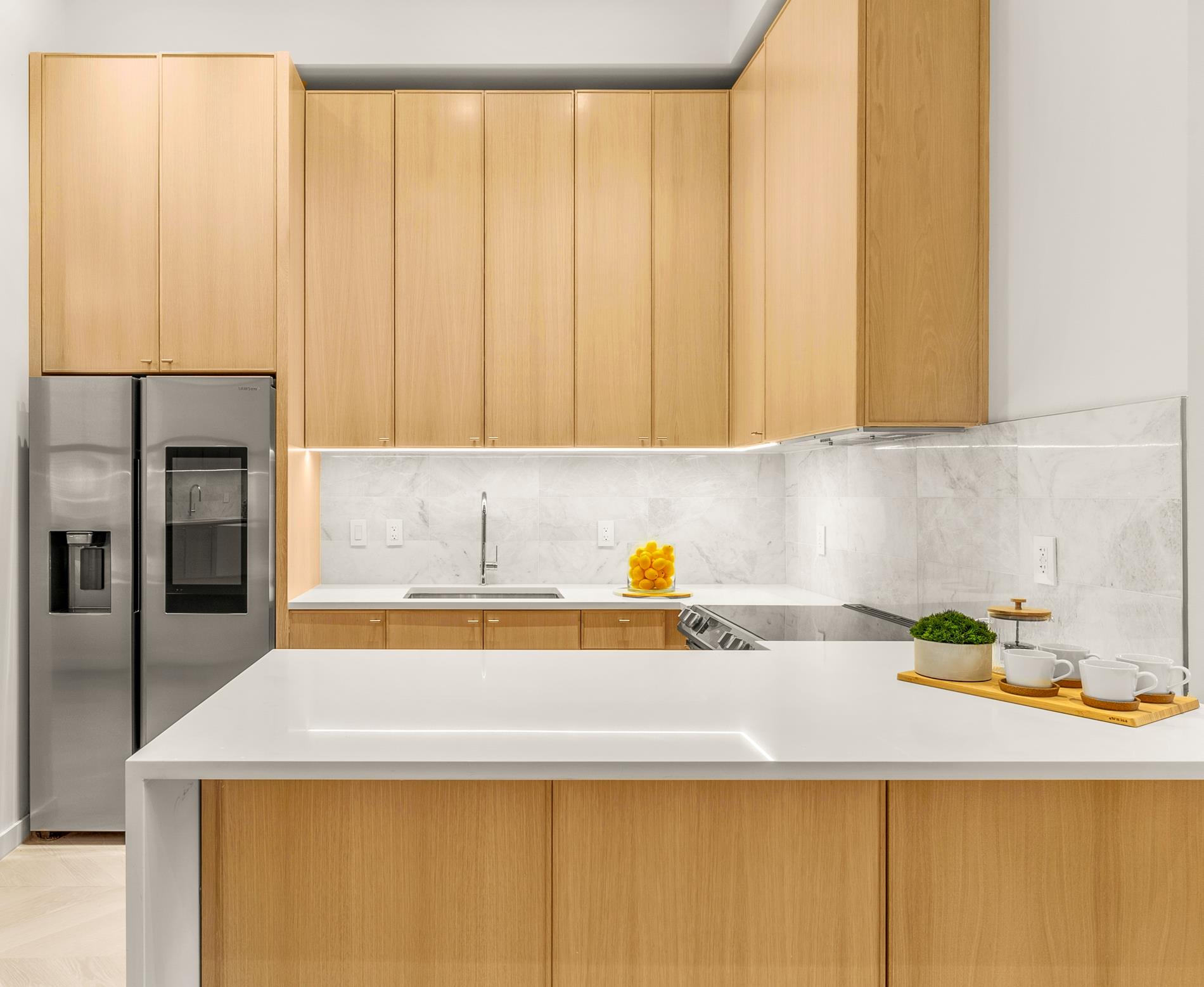 a kitchen with a sink a stove and cabinets