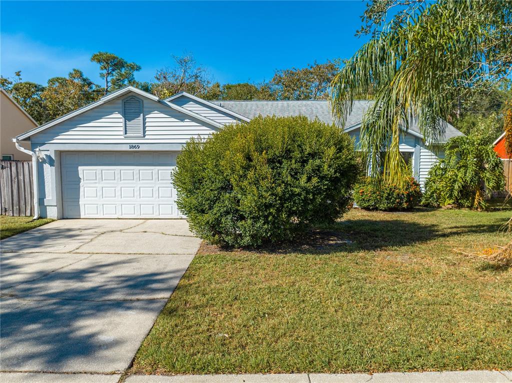 a view of front of house with a yard