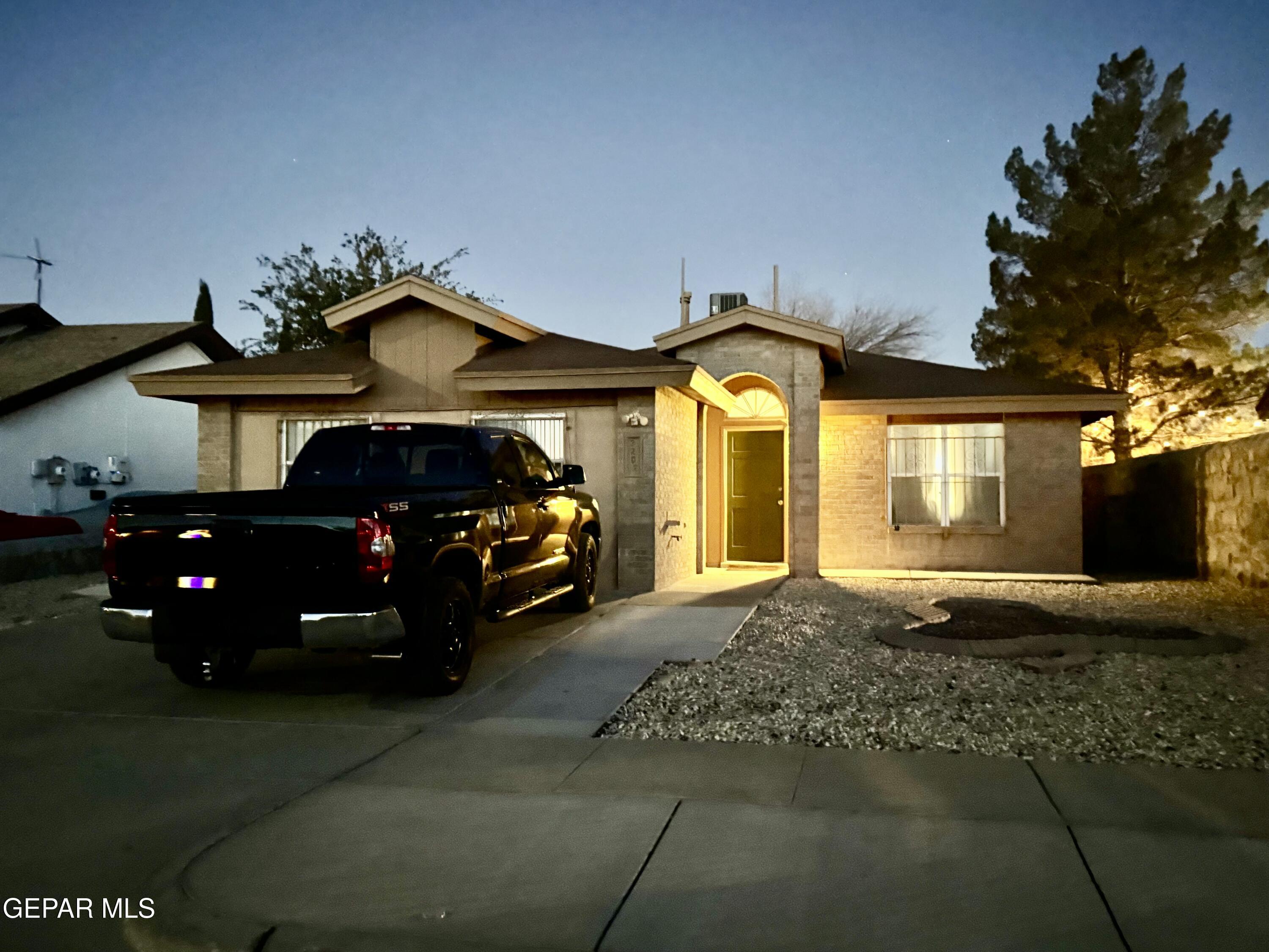 a front view of a house with parking space